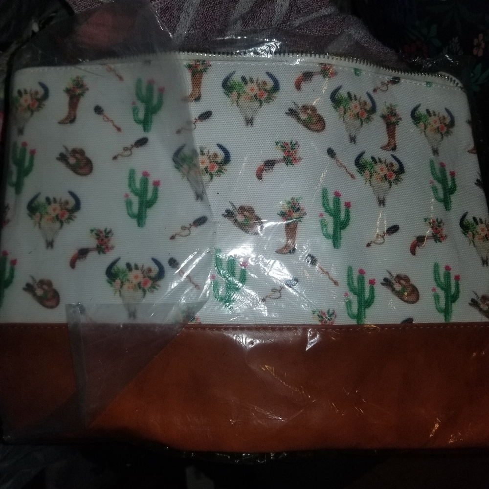 New bullhead Make up bag or can be used as wristle